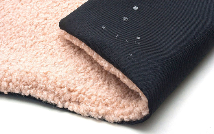 water droplets on the underside of the Settle Mat / Travel Mat to show it is waterproof